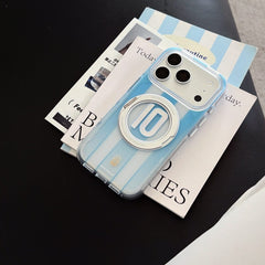 An Argentina sky blue soccer stripe iPhone case lying flat on magazines.