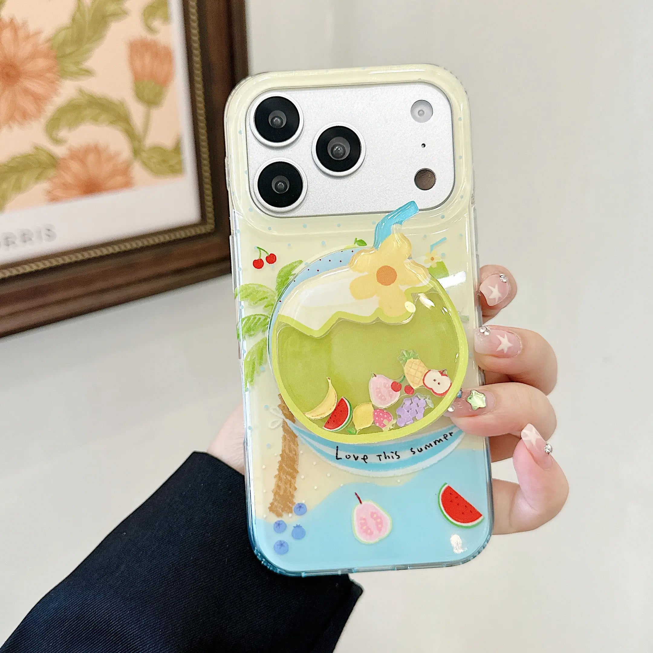 Hand holding a tropical summer iPhone case with a 3D coconut grip.