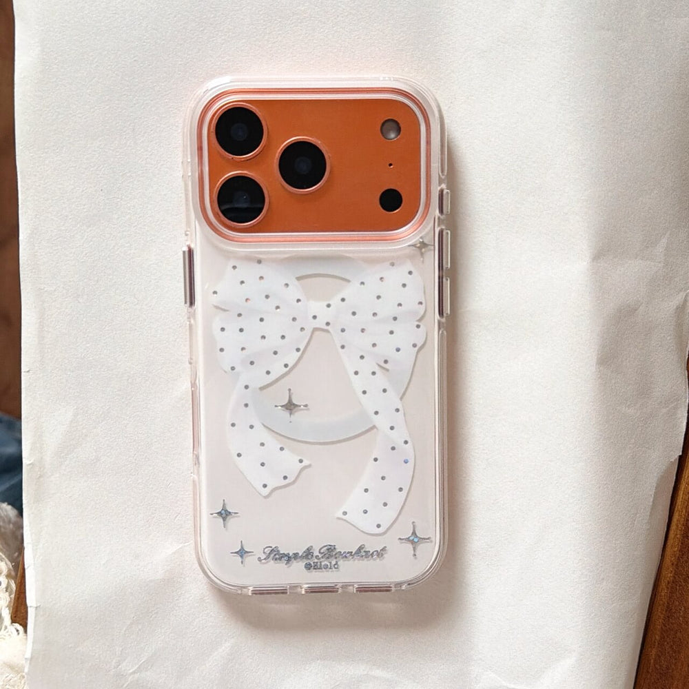 White bow glitter clear iPhone case on orange iPhone