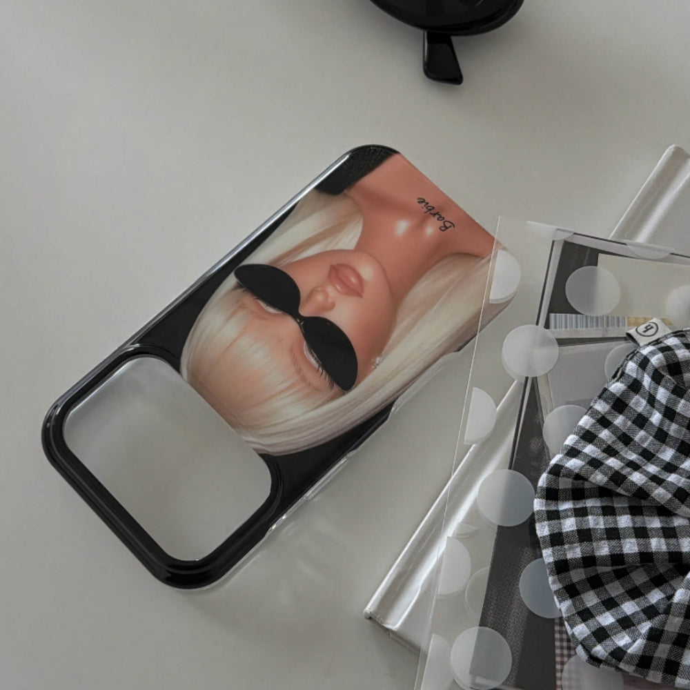 Flat lay of a black Y2K fashion girl iPhone case with sunglasses artwork.