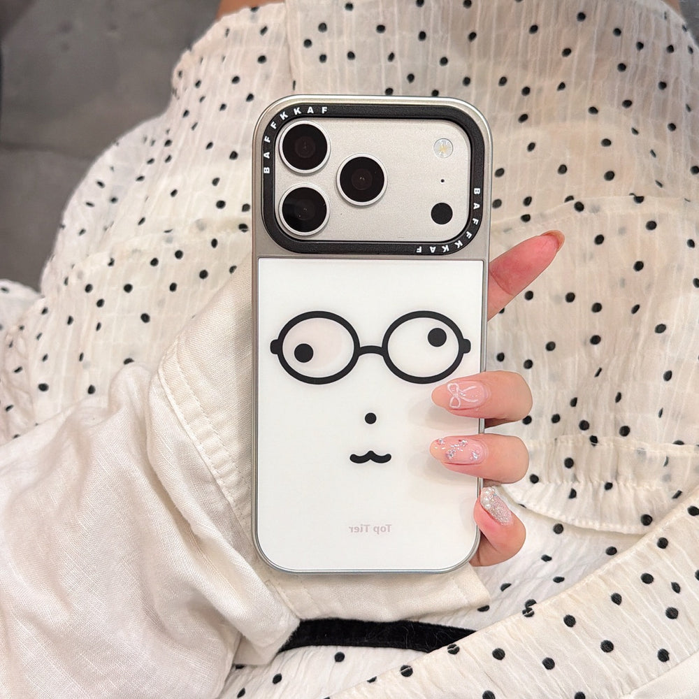 Y2K style geek glasses phone case held against a white polka dot dress background.