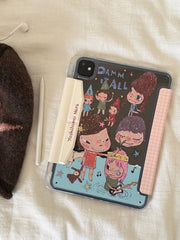 Flat lay view of a Yoshitomo Nara iPad case clear back shell with black cartoon print, an Apple Pencil, and a brown plush star beanie on a white fabric surface.